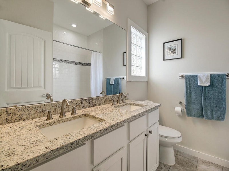 Owner's bath with his/her sinks, granite counter.