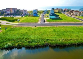 Drone photo over the lot for the incredible morning sunrises. Beach views possible w 2/3 story build.