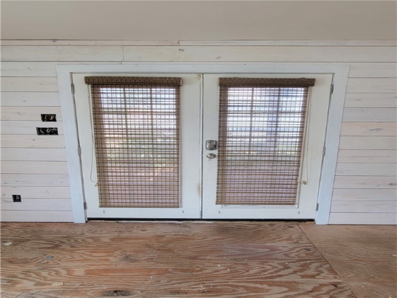 French doors lead to the front porch.