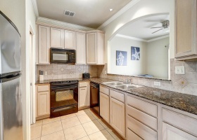 Fully equipped kitchen with granite counters.