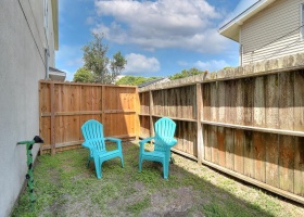 Fenced small back yard for your pets.