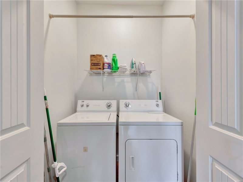The first floor laundry closet provides convenience