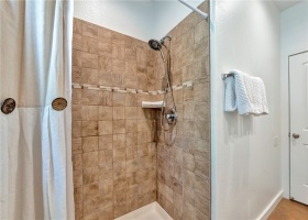 En suite shower has custom tile