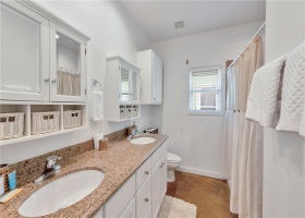 The master en suite features a double vanity and large walk-in shower
