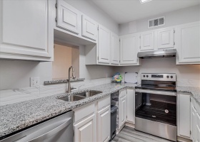 Updated kitchen with new granite counters, new cabinets, new stainless steel appliances.