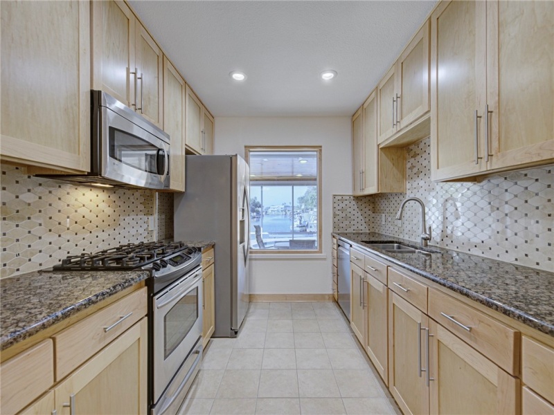 Kitchen with view of water & Pool