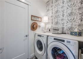 Laundry room with full size washer dryer