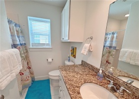 One of 2.5 bathrooms. Shower and granite counter