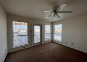 Guest room or office with a private deck porch overlooking the canal.