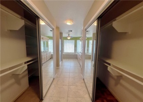 Master bathroom has a his and hers closet with full mirror doors on both sides.