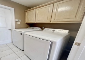 Storage above washer and dryer.