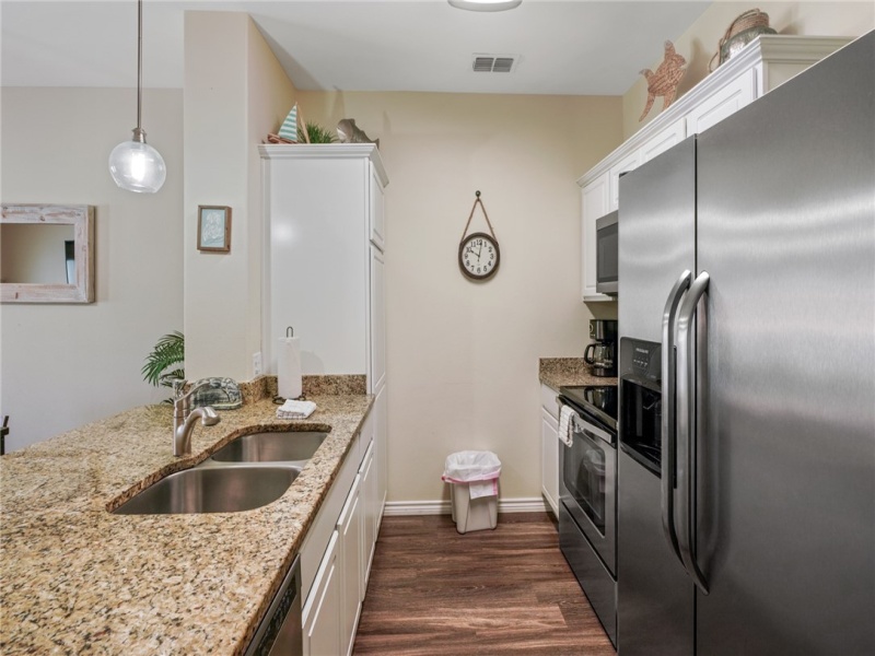 Looking into the Kitchen Area and seeing the appliances & Pantry