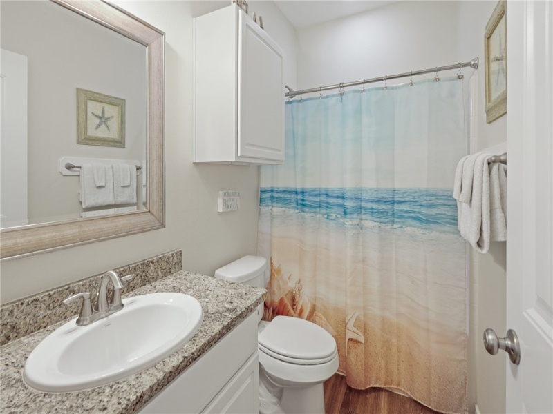 Full Bathroom located in back bedroom.