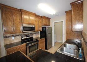 Granite counters and SS appliances.  Refrigerators convey.
