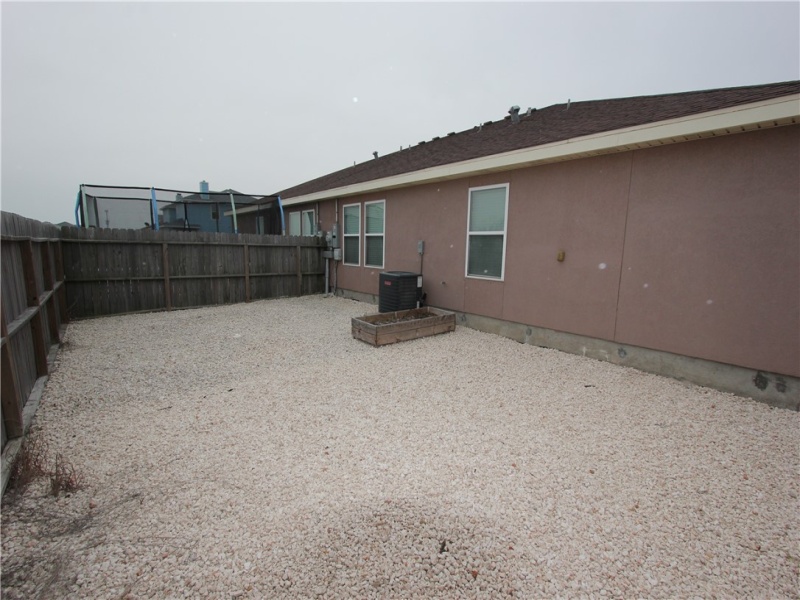 Back yard.  Big enough for a trampoline.