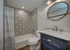 Bathroom with tiled shower.