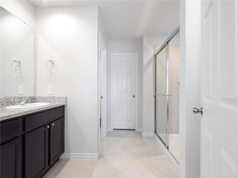 Primary bathroom with walk-in shower.