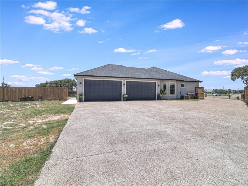 4 CAR OVERSIZED GARAGE W/9 FOOT DOORS & LG DRIVEWAY