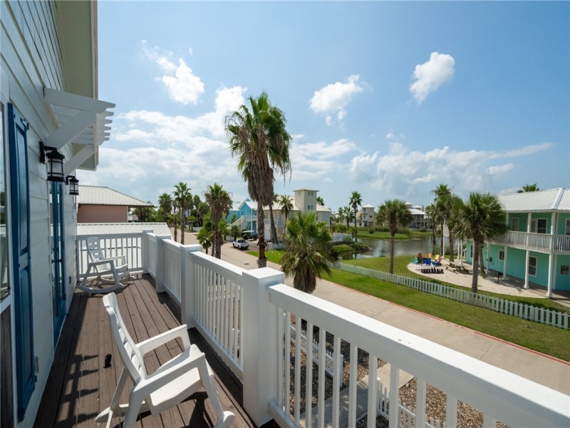 Upstairs large deck only accessed by the primary bedroom.  Great view of the serene pond