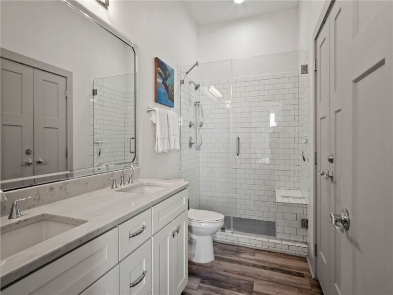 Primary Bathroom with double vanity and walk-in shower.