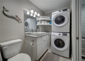 Master bathroom houses washer/dryer for ease of doing your laundry.