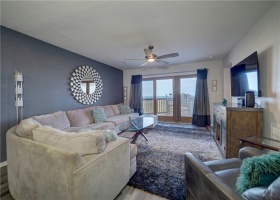 Enjoy the view of the Gulf of Mexico while relaxing on the sofa.