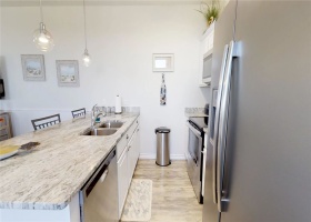 Kitchen with stainless steel appliances and granite counter tops.