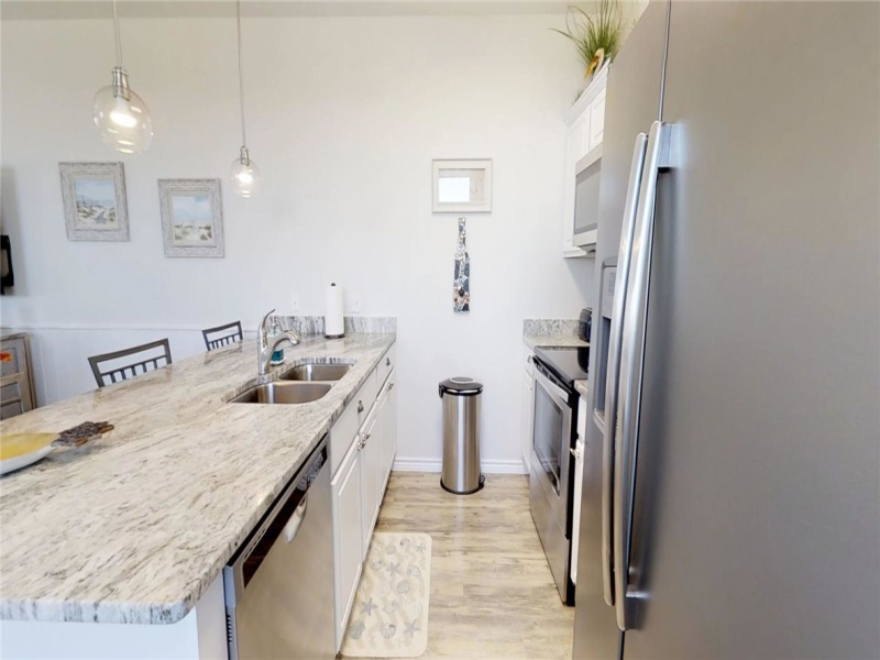 Kitchen with stainless steel appliances and granite counter tops.