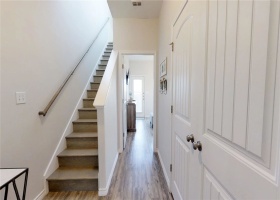 Stairway to living area and kitchen.