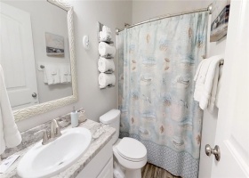 Downstairs attached full bath with single sink and tub/ shower comb.