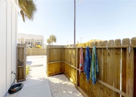 Private, large fenced outdoor space with patio.