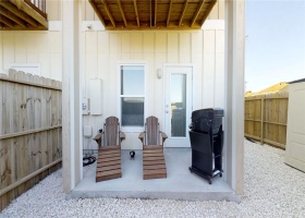 Corner townhome with extended private, fenced in outdoor space with side patio.