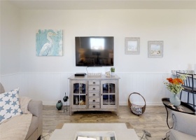  comfortable seating, ceiling fan and large flat screen tv.