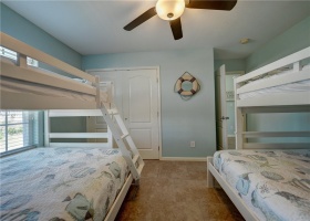 The second bedroom offers lots of sleeping space with bunks.