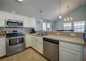 Kitchen offers stainless appliances, easy care countertops and tile floors.
