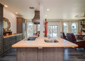 Kitchen island has room for 6 barstools and a view out to the decks and canal.