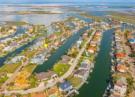 Expanded aerial view of the ideal Island Moorings location of this property with 1 1/2 lots! Low $300 annual HOA