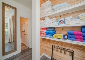 Open and spacious hall linen closet. This home has lots of closets!