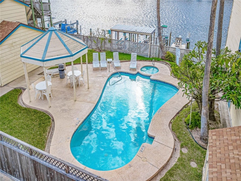 Waterfront pool and hot tub area.