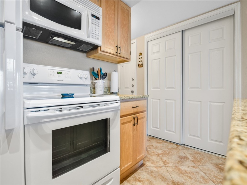 Closet across from the kitchen is the water heater and stackable washer/dryer.