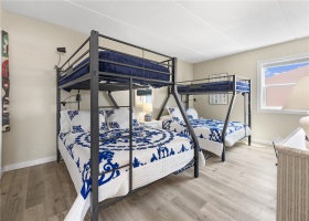 Large second bedroom with two twin over full bunkbeds.