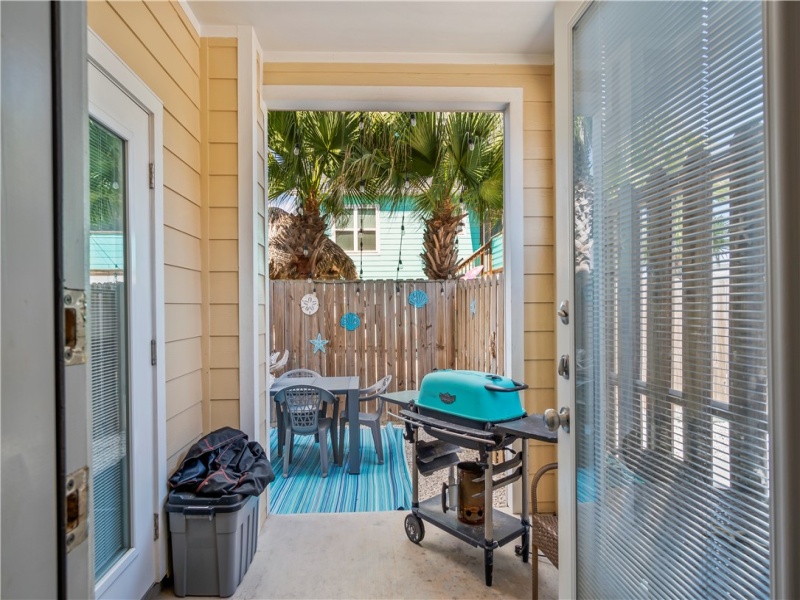 This ground-floor covered patio is accessed by the two bedrooms and is perfect for grilling or just hanging out.