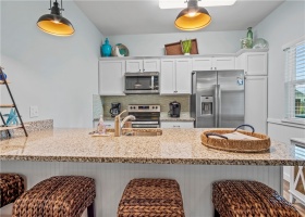 This townhome has pantry space off to the right of the refrigerator for all your snacks and kitchen staples. Not many units have this feature and it's a welcome space for owners and guests alike.