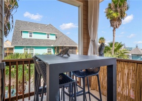 The 2nd floor patio off the kitchen/family area is perfect for morning coffee. Close the curtains for privacy while still enjoying the ocean breeze.